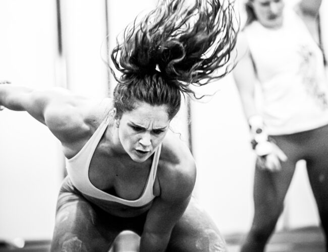 Black & White: Focused Athlete Swinging Kettlebell, Intense, Dynamic Energy